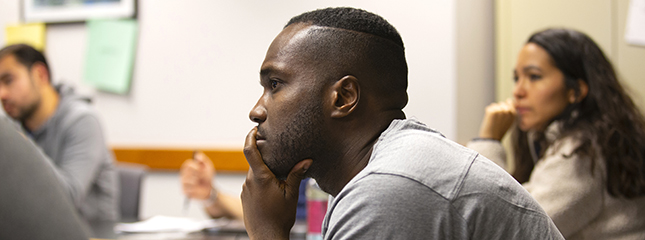 Students listen intently during an Immigration Law Clinic lecture