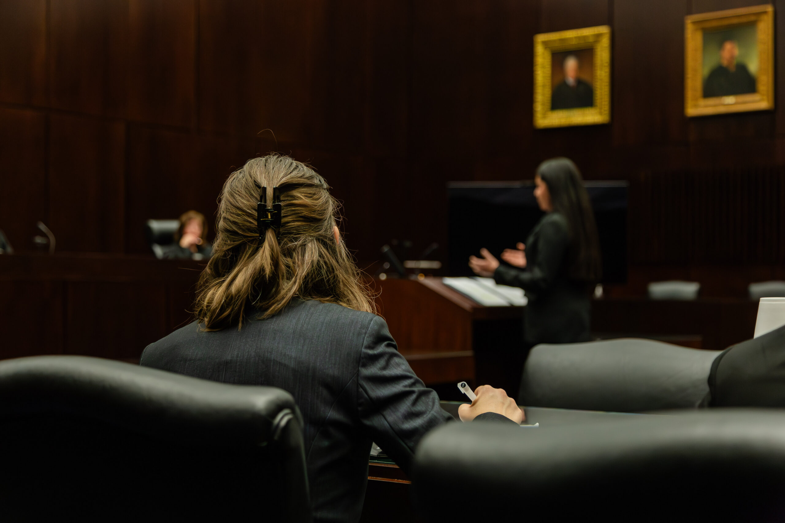 Two women appear in court before a judge